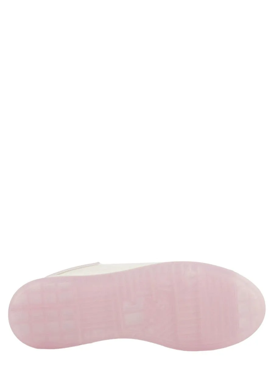 Sneakers in pelle con retro in gomma a contrasto